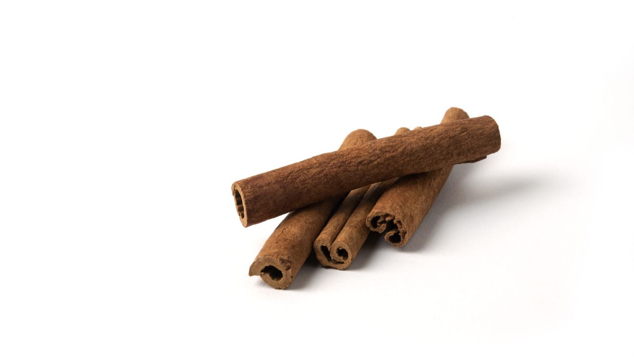 cinnamon sticks isolated white scaled 097e3be6