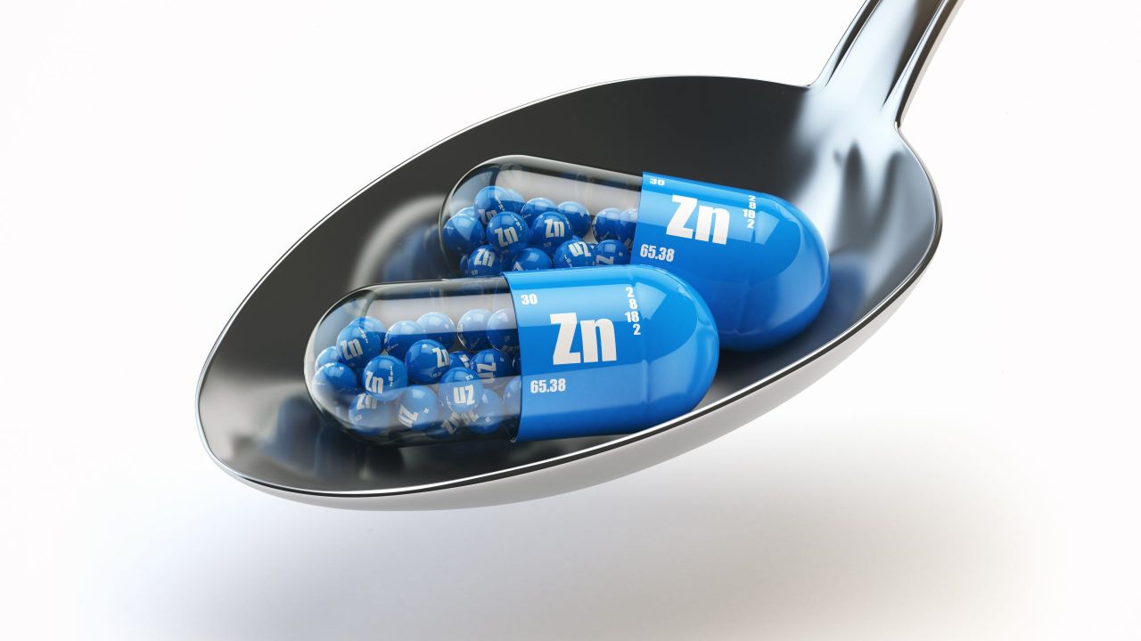 pills with zinc zn element spoon dietary supplements vitamin capsules 3d illustration scaled 80831b3e